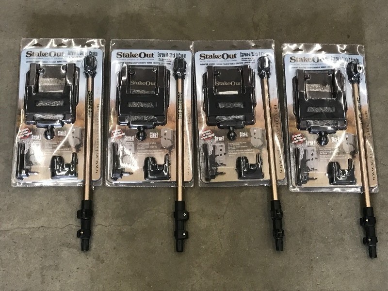 lot 56 image: (4) New Stake-Out Game Camera Holder Sets