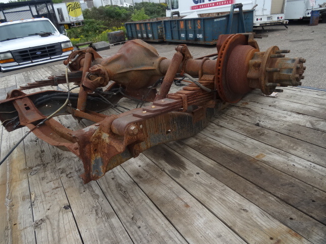 Rear axle assembly off of a Ford E series truck.