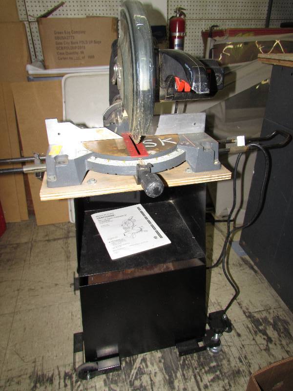 lot 218 image: CRAFTSMAN 10 COMPOUND MITER SAW MOUNTED ON A STAND