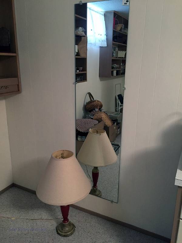 lot 78 image: Mirror and lamp