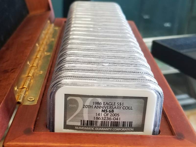 GROUP OF NGC CERTIFIED SILVER EAGLES 1986-2005 IN WOODEN BOX (20 COINS)
