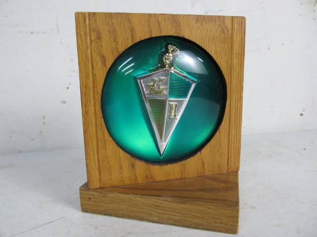 lot 102 image: Vintage Auto Emblem Display