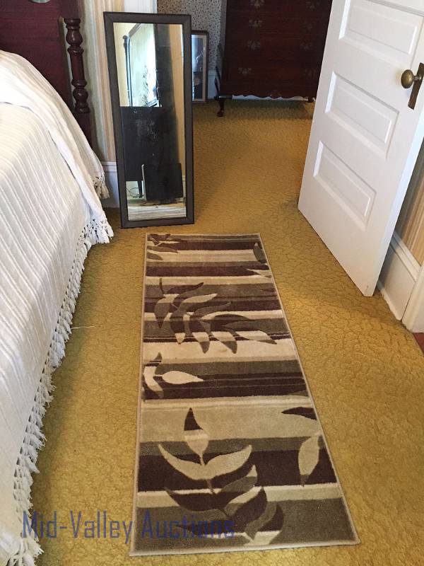 Vintage mirror and hallway rug