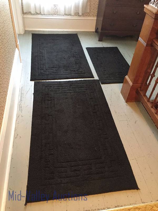 3 black rugs