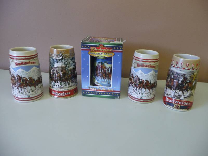 lot 72 image: BUDWEISER HOLIDAY STEIN COLLECTION (1) 2002 IN BOX (2) A SERIES (1) B SERIES (1) C SERIES - GREAT CONDITION SEE PICTURES
