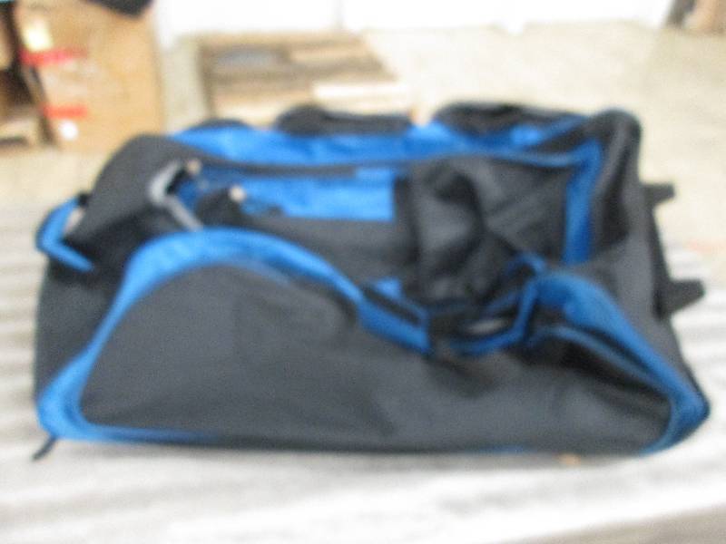 lot 32 image: Multi Pocket Upright Duffel by Trav...