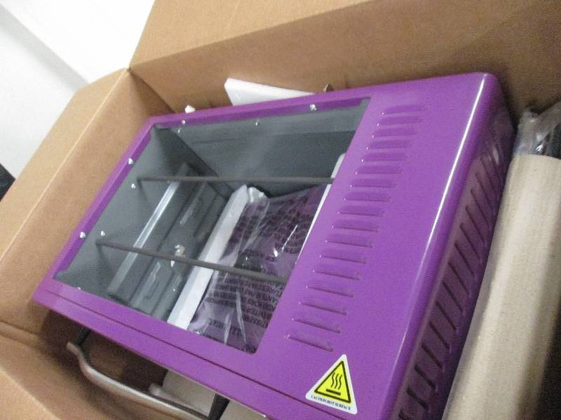 lot 36 image: 10-In-1 Everything Oven by Ginnys ...