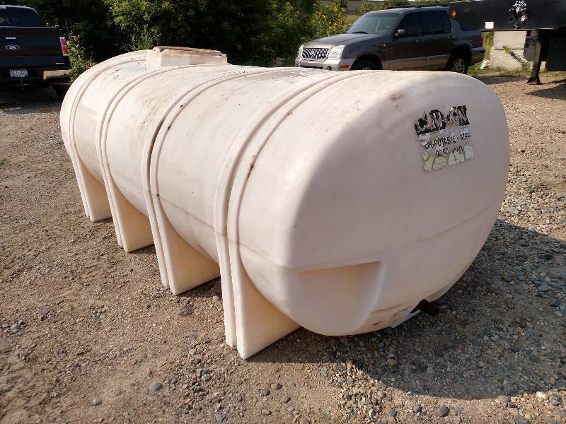 lot 135 image: 1235 Gallon Poly Tank, Elliptical L...