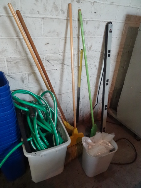 lot 39 image: Misc Garden Hose. Misc Brooms,