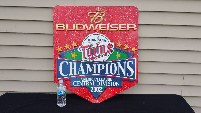 lot 48 image: Budweiser Minnesota Twins 2002 Central Champions Metal Advertising Sign