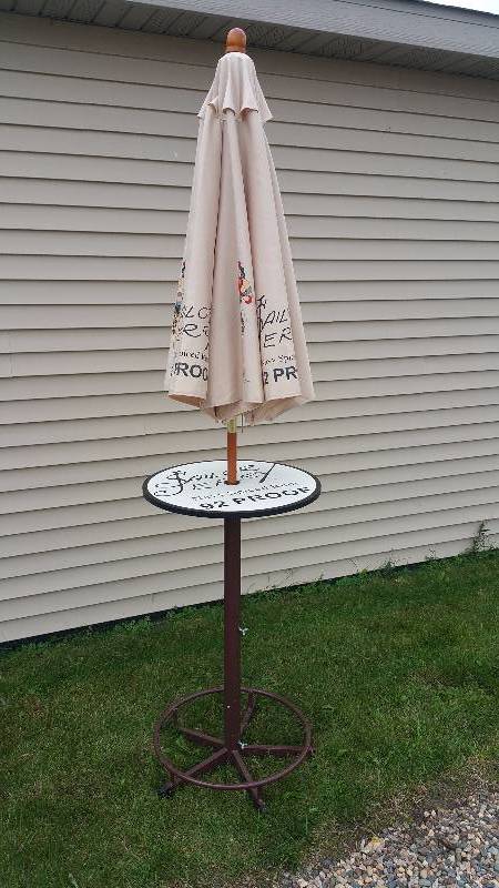 lot 76 image: Sailor Jerry Patio Umbrella & Table