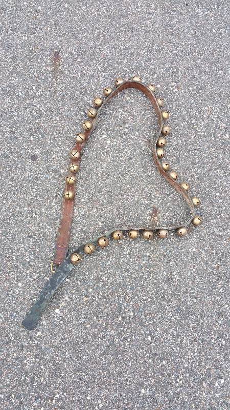 lot 108 image: 7 2 Antique Sleigh Bells on Leather Strap