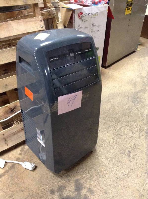 lot 49 image: LG Portable Air Conditioner missing window piece, one of the wheels is damaged