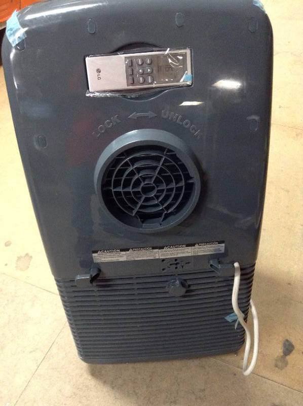 lot 135 image: LG Portable Air Conditioner missing window piece, one of the wheels is damaged