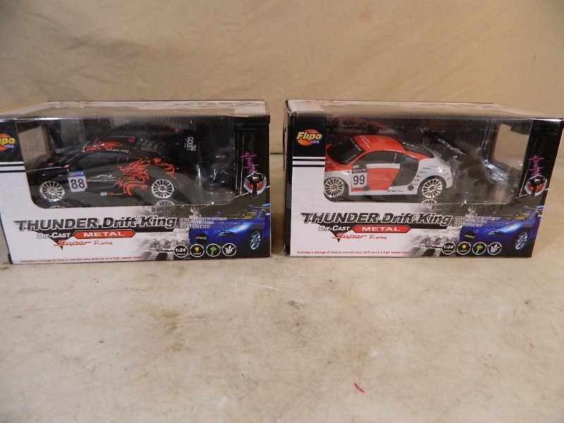 lot 119 image: 2 New Thunder Drift King Metal RC Cars