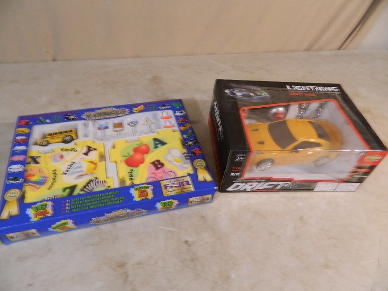lot 123 image: Two New Vehicle Toys