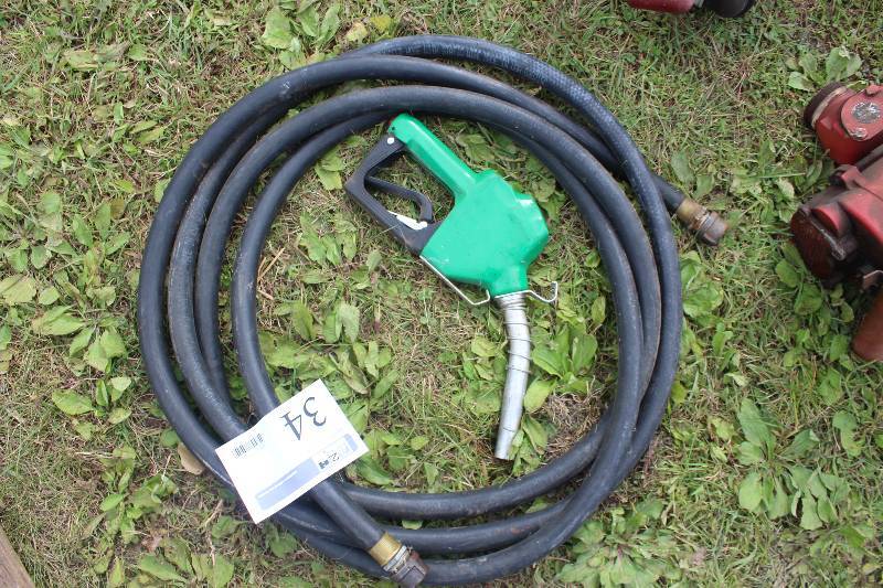 lot 34 image: Gasoline Pump Handle w Hose