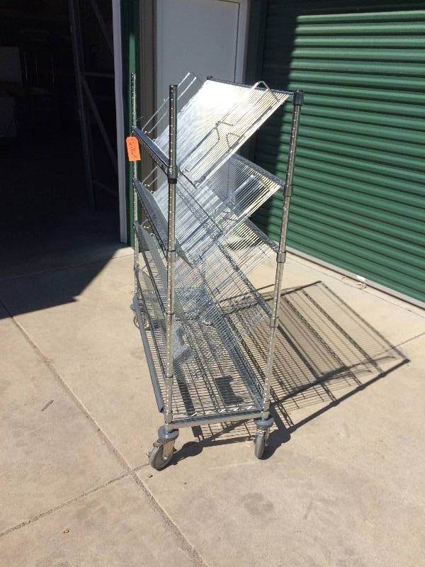 lot 46 image: Heavy Gauge Steel Slanted Wire Mobile Shelving On Wheels Merchandising Cart Easily Move Products or Assemble Kits In Your Warehouse - Great Condition