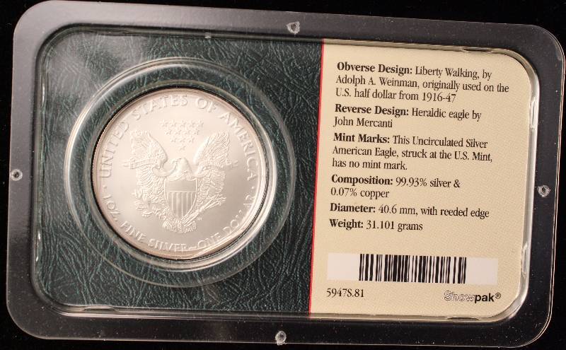 lot 73 image: 2009 AMERICAN SILVER EAGLE 1 TROY OZ. .999 FINE SILVER IN LITTLETON HOLDER