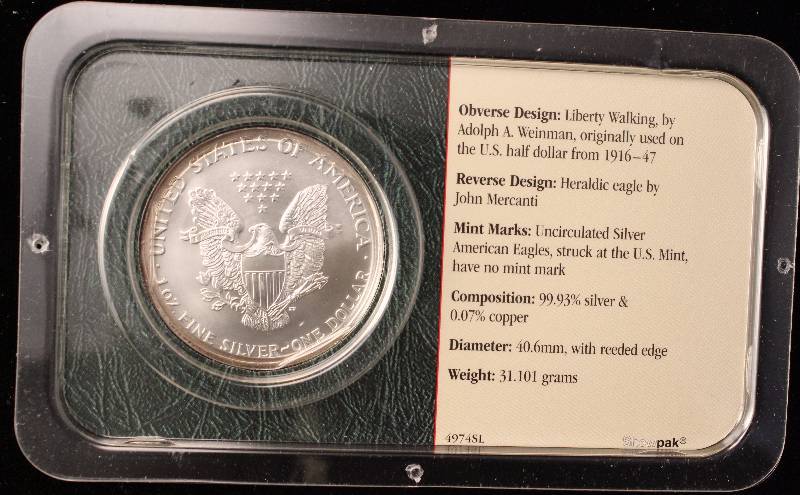 lot 79 image: 2002 AMERICAN SILVER EAGLE 1 TROY OZ. .999 FINE SILVER IN LITTLETON HOLDER