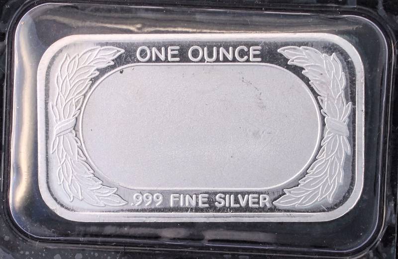 lot 12 image: 1 TROY OZ. .999 FINE SILVER BAR FLAG DESIGN SEALED