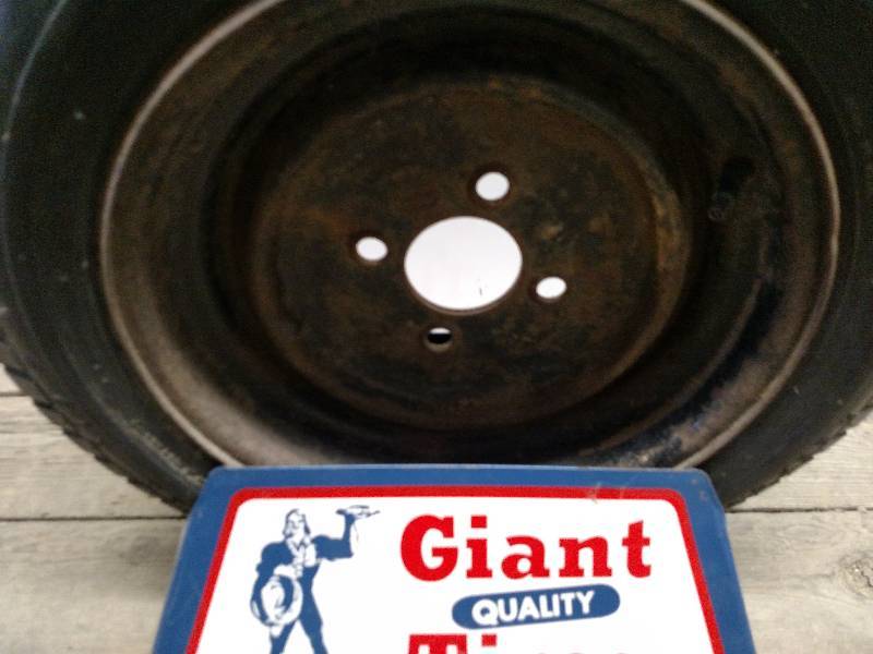 lot 455 image: Vintage Giant Tires Display with Wh...