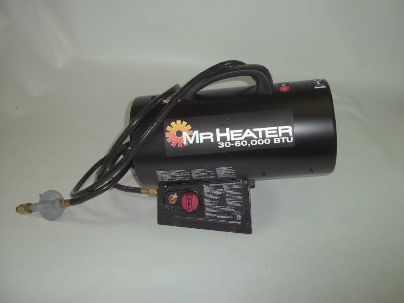 lot 16 image: Mr. Heater propane 30,000 and 60,000 BTU heater with electric fan.  Consignor said it was only used 2 hours.  16 inches long