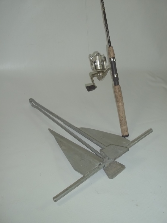 lot 17 image: Mitchell 6 foot medium walleye rod and reel combo and 13 pound digger anchor