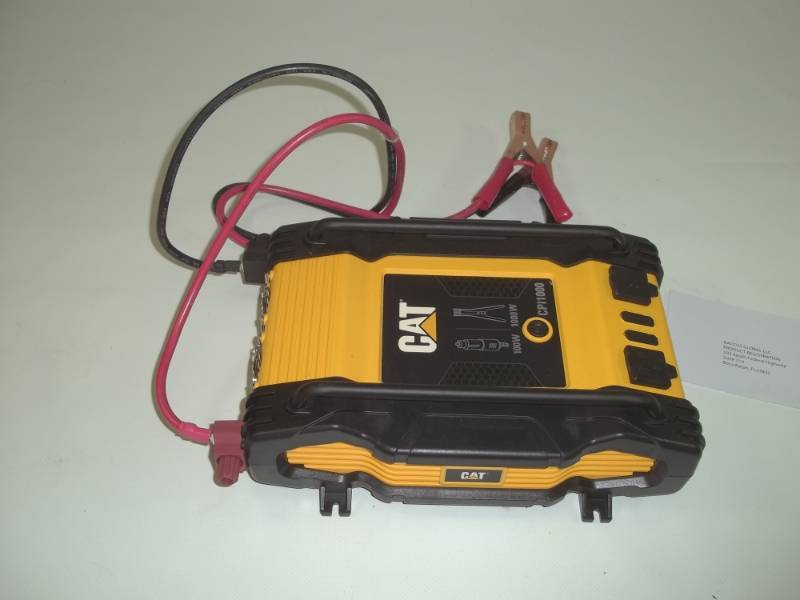 lot 19 image: Cat 100 and 1000 watt inverter.  Model # CPI1000.  Consignor said its brand new and works