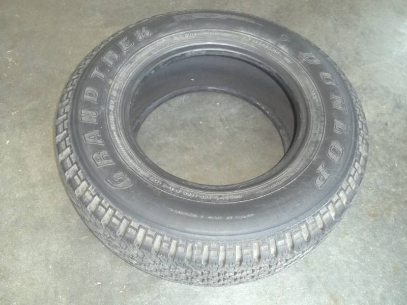 lot 22 image: Dunlop Grandtrek P22575R15.  Passenger tire.  Consignor said less than 1000 miles on tire