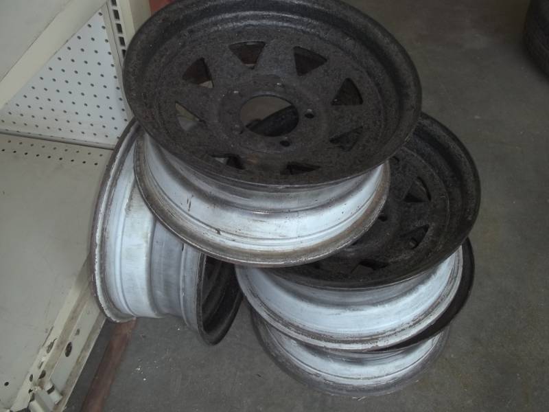 lot 24 image: 4 matching black trailer tire rims for R14 tires