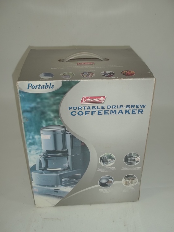 lot 31 image: Coleman portable drip brew coffee maker.  Works on your camp stove or grill.  Consignor said he used it once.