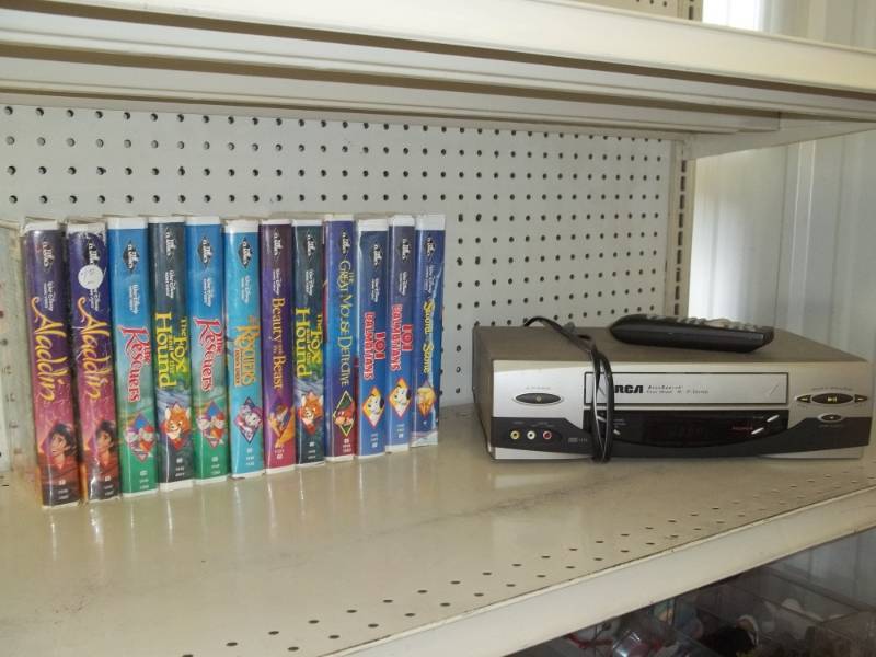 lot 154 image: Disney Black Diamond VHS Tapes and VHS Player