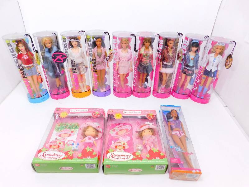 lot 6 image: Lot of Unopened Barbies and Strawberry Shortcake Dolls