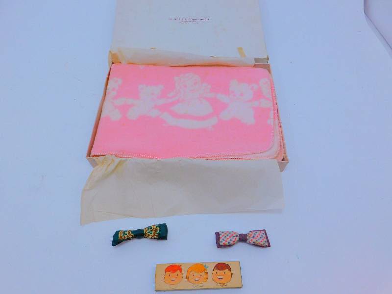 lot 22 image: Vintage Baby Items - Blamket, Bow Ties, and Toothbrush