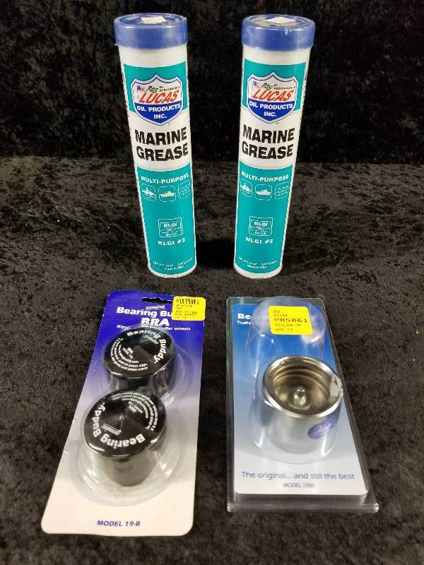 lot 42 image: Lot - Bearring Buddy Bra, Trailer Wheel Bearing (1 missing), (2) Marine Grease 14oz tubes
