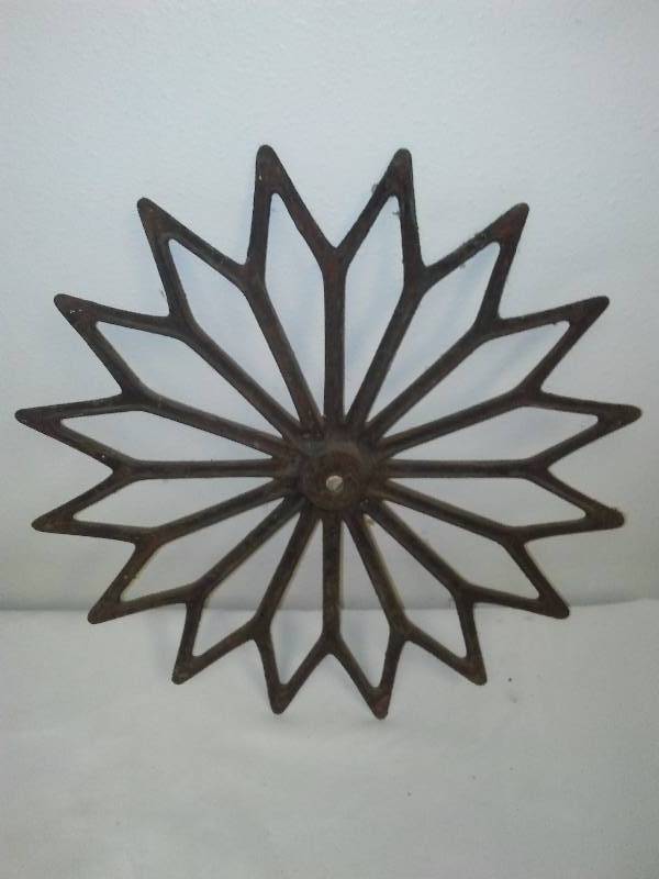 lot 30 image: Ornate Iron Starburst, approx. 3 lbs. 16  diameter