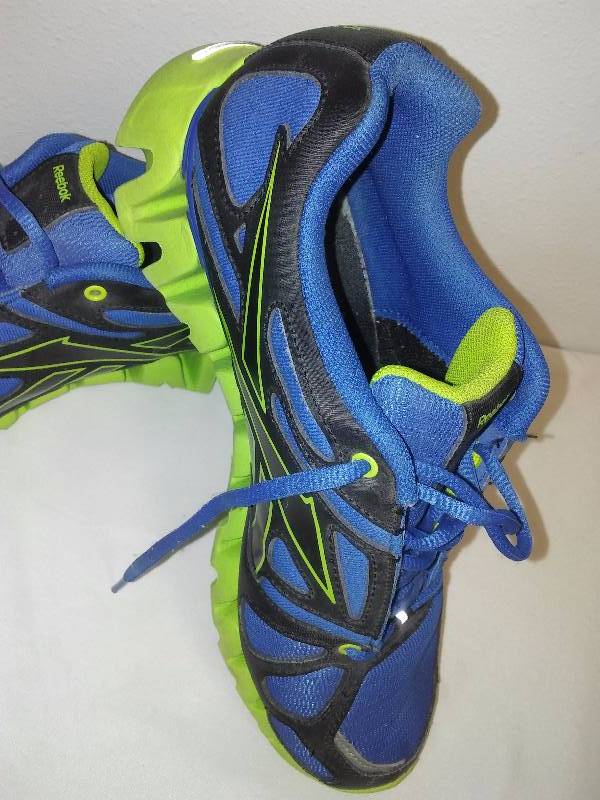 lot 32 image: Like New Reebok Mens (sz. 7) and Sketchers Brown womens Shoes (sz 8)