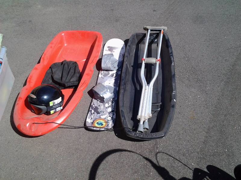 lot 20 image: 2-Sleds, Snowboard, Ski Helmet, Goggles, Pair Of Crutches