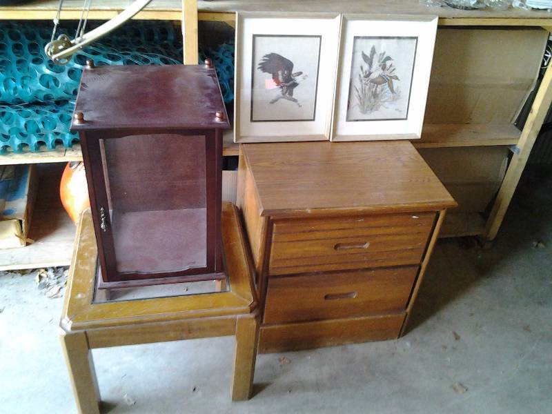 lot 36 image: 2-Door Cabinet 22x17x23, Small Glass Top Table, 2-Framed Needle Work, 1-Glass Display Box 13x13x19