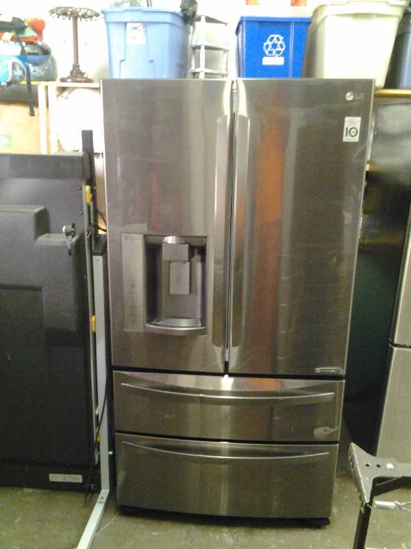 lot 1 image: LG Stainless Steel Front With Black Sides French Door Refrigerator - Works