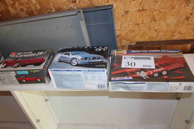 lot 30 image: Lot of (3) 125 Scale Plastic Model Kits Includes Revell Race Car Trailer w Equipment, Revell 2006 Mustang GT, AMT 1995 Chevrolet Corvette ZR1