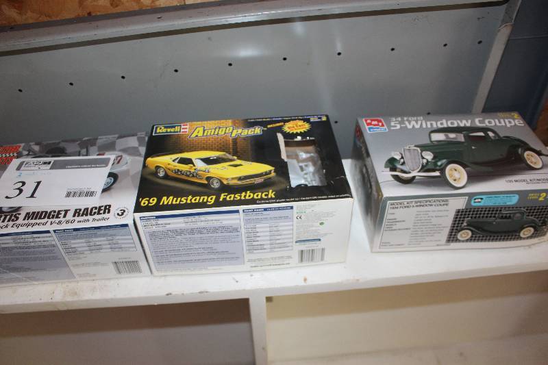 lot 31 image: Lot of (3) 125 Scale Plastic Model Kits Includes AMT 1934 Ford 5-Window Coupe, Revell 1969 Mustang Fastback, Revell Kurtis Midget Racer
