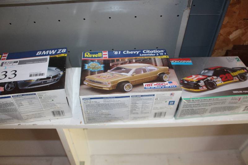 lot 33 image: Lot of (3) 124 Scale Plastic Model Kits Includes Revell BMW Z8, 1981 Chevrolet Citation Lowrider, #28 Havoline Ford Thunderbird