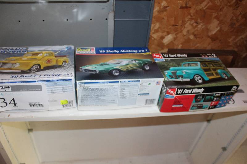 lot 34 image: Lot of (3) 125 Scale Plastic Model Kits Includes AMT 1941 Ford Woody, Revell 1969 Shelby Mustang, Revell 1950 Ford F-1 Pickup