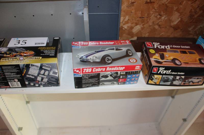 lot 35 image: Lot of (3) 125 Scale Plastic Model Kits Includes AMT 1934 Ford 2-Door Sedan, AMT 289 Cobra Roaster, Metal Custom finish PT Cruiser