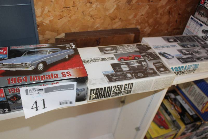 lot 41 image: Lot of (3) 124 Scale Plastic Model Kits Includes AMT 1964 Impala SS, High Tech Model Ferrari 250 GTO Competition, High Tech Model Cobra Daytona Coupe