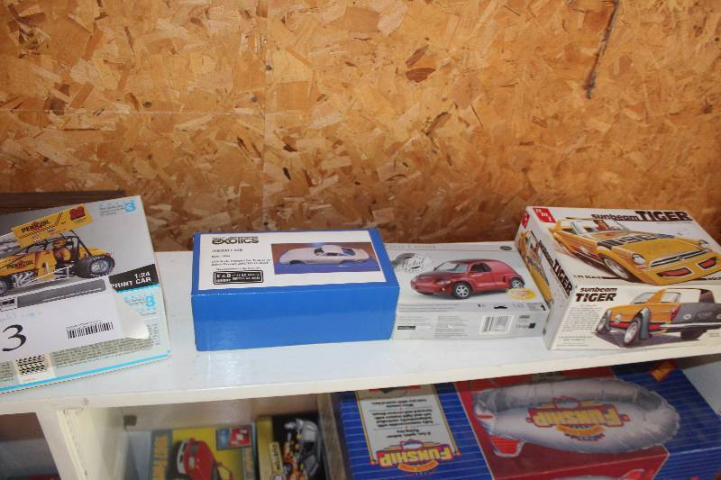 lot 43 image: Lot of (4) 124125 Scale Plastic Model Kits Includes Monogram Pennzoil #22 Sprint Car, Mini Exotics 250330 LMB, 143 Metal PT Cruiser, AMT Sunbeam Tiger