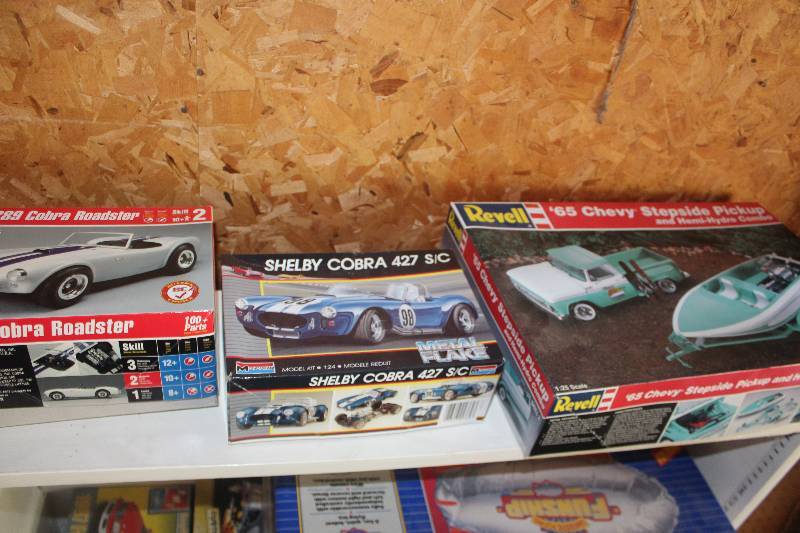 lot 51 image: Lot of (3) 125 Scale Plastic Model Kits Includes AMT 289 Cobra Roadster, Monogram Shelby Cobra 427 SC, Revell 1965 Chevy Stepside Pickup