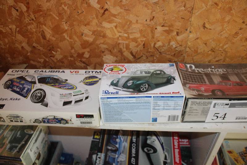 lot 54 image: Lot of (3) Scale Model Kits Includes DTM 124 Opel Calibra V6, Revell 1937 Ford Coupe Street Rod, AMT Prestige 125 1955 Mercedes-Benz 300 SL Gullwing